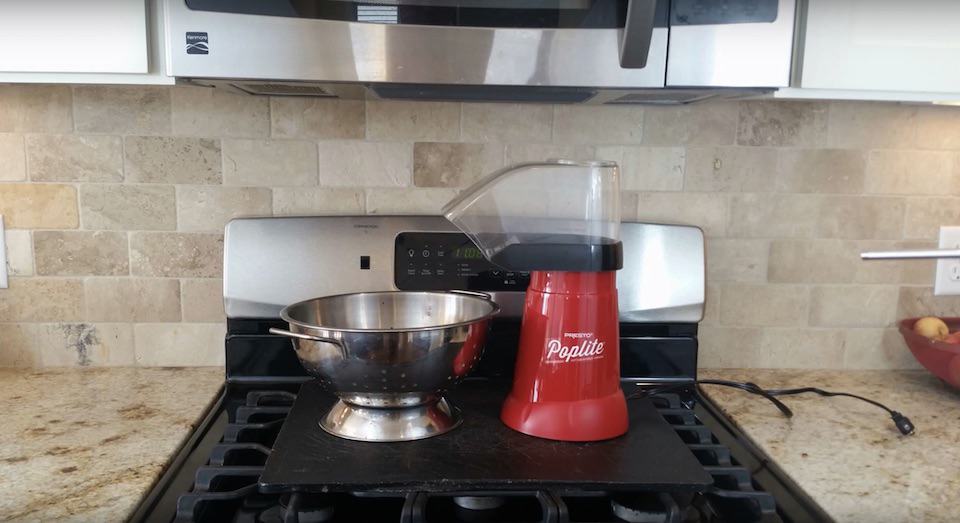 Roast coffee beans with a popcorn popper under the stove vent