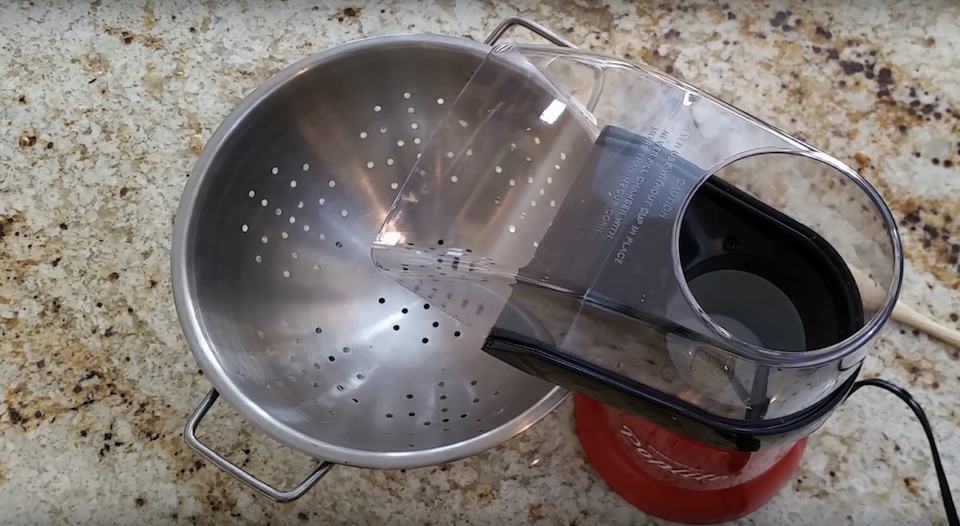 Metal colander can catch the chaff from the coffee beans