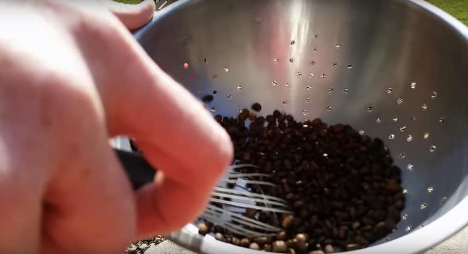 Stirring the coffee beans to cool