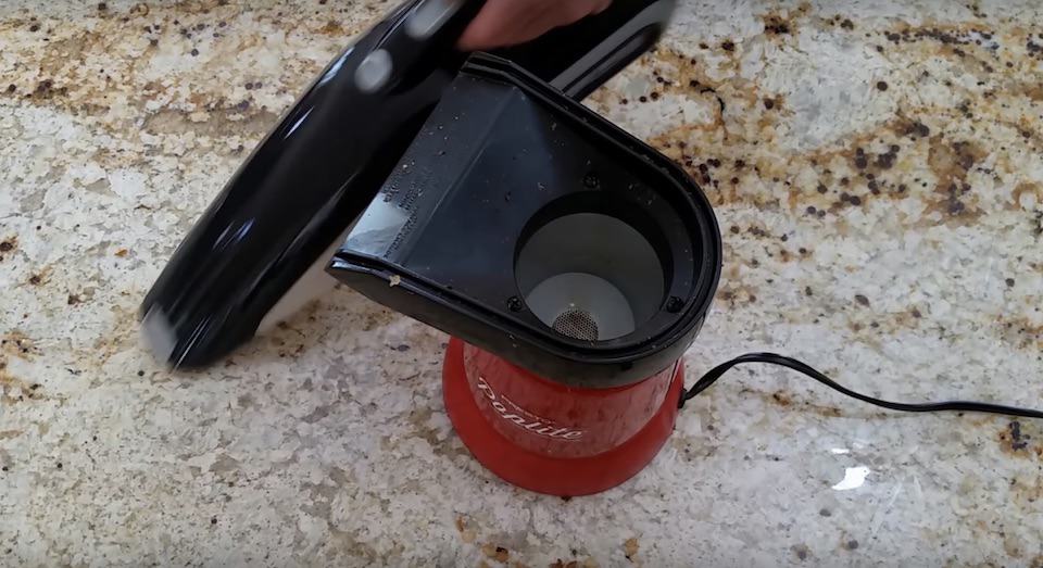 Vacuuming the chaff after roasting coffee beans