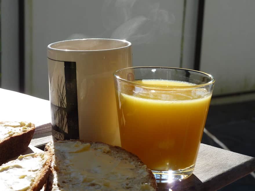 Coffee and orange juice side by side
