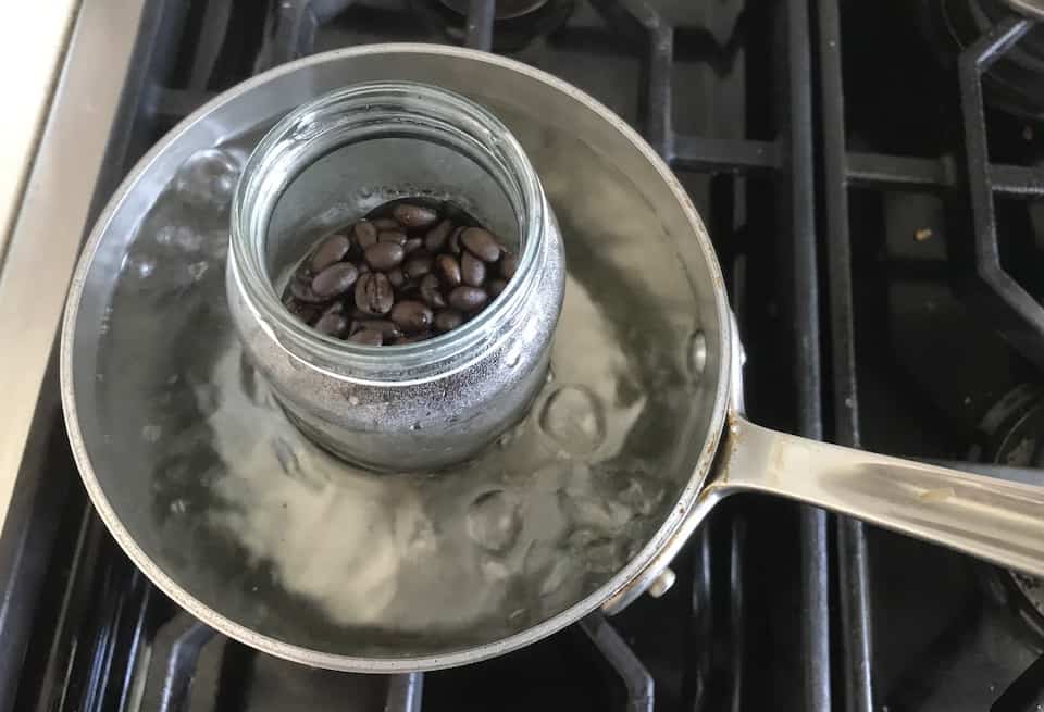Brewing coffee from whole beans over the stove