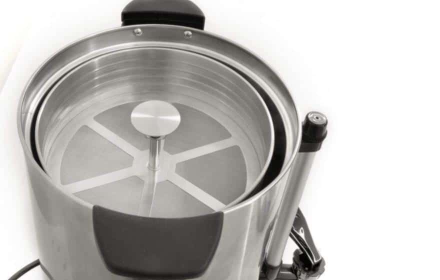 A view inside the lid of a large coffee percolator