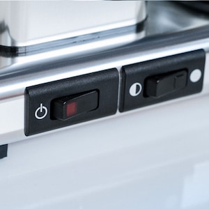 Closeup of the dual-setting hotplate switch on a Technivorm Moccamaster