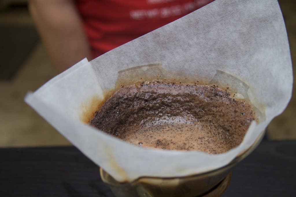 Closeup of a Chemex filter with pour-over coffee brewing