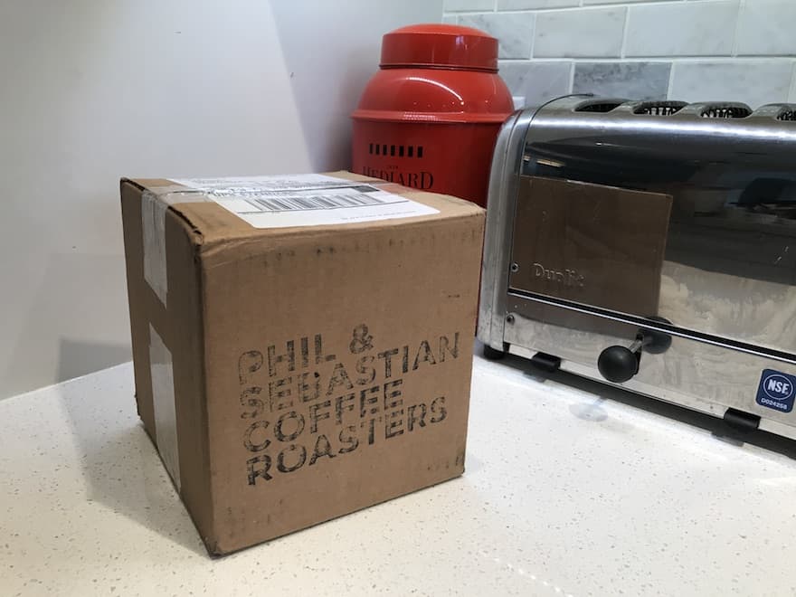 cardboard box containing coffee from Phil & Sebastian Coffee Roasters