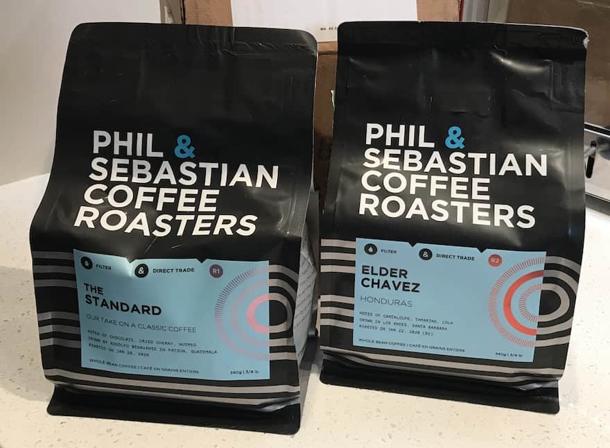 Closeup of two bags of coffee from Phil & Sebastian Coffee Roasters