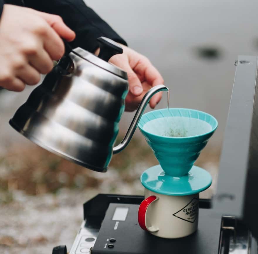 Brewing on a camping stove with a Hario V60 pour-over coffee brewer