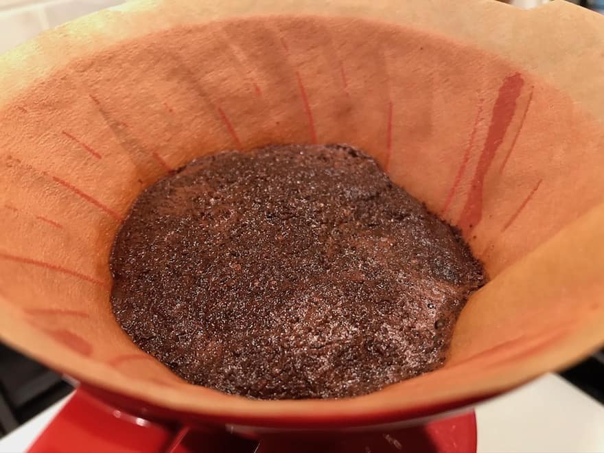 Coffee blooming in a pour-over cone