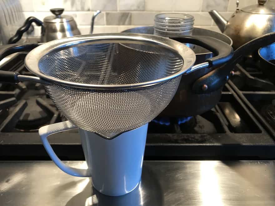 Strainer on top of a coffee mug