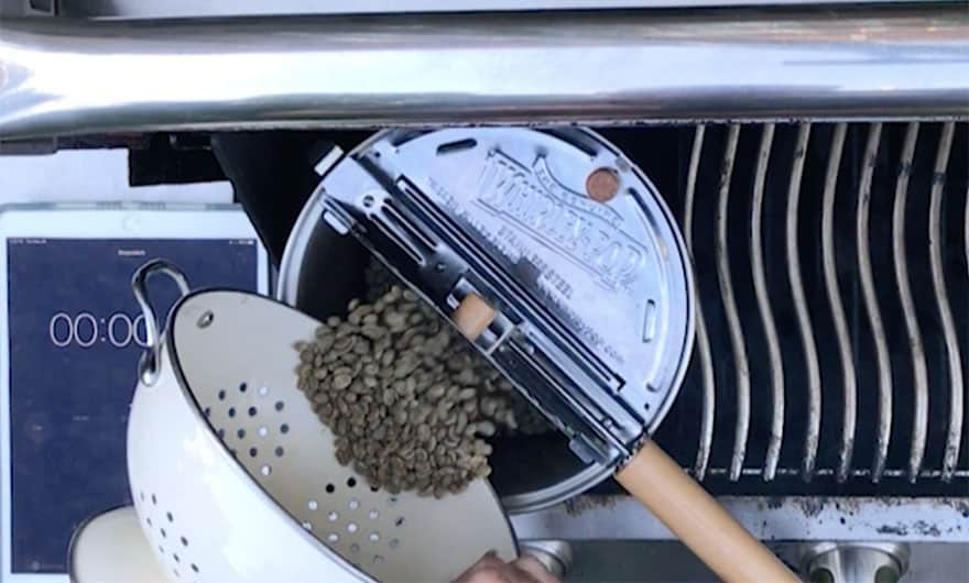 Pouring green coffee beans into a Whirley Pop