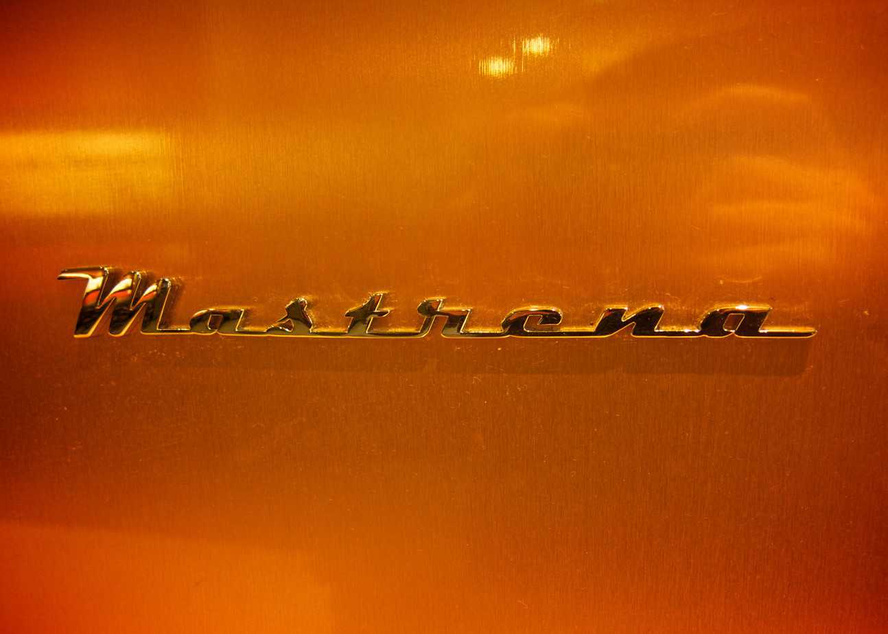 The Mastrena logo in raised lettering on the outside of a Mastrena espresso machine at Starbucks