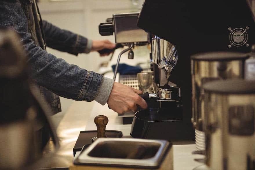 Barista prepares to brew an espresso