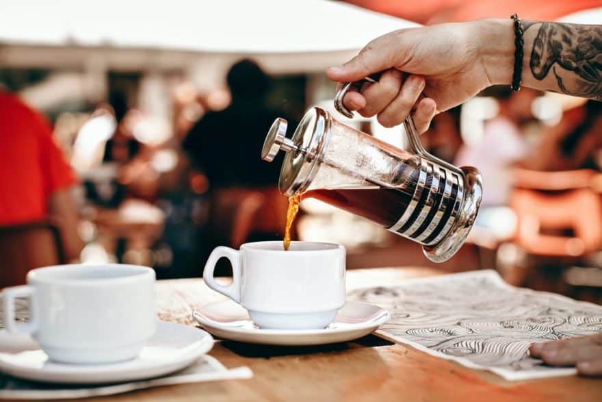 An elegant French Press used in a coffee shop.