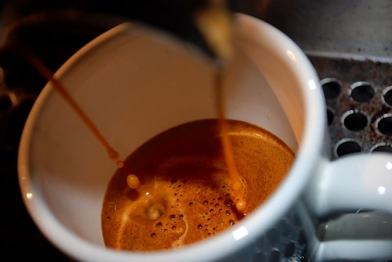 Espresso should be foamy and golden brown as it drops into the cup.