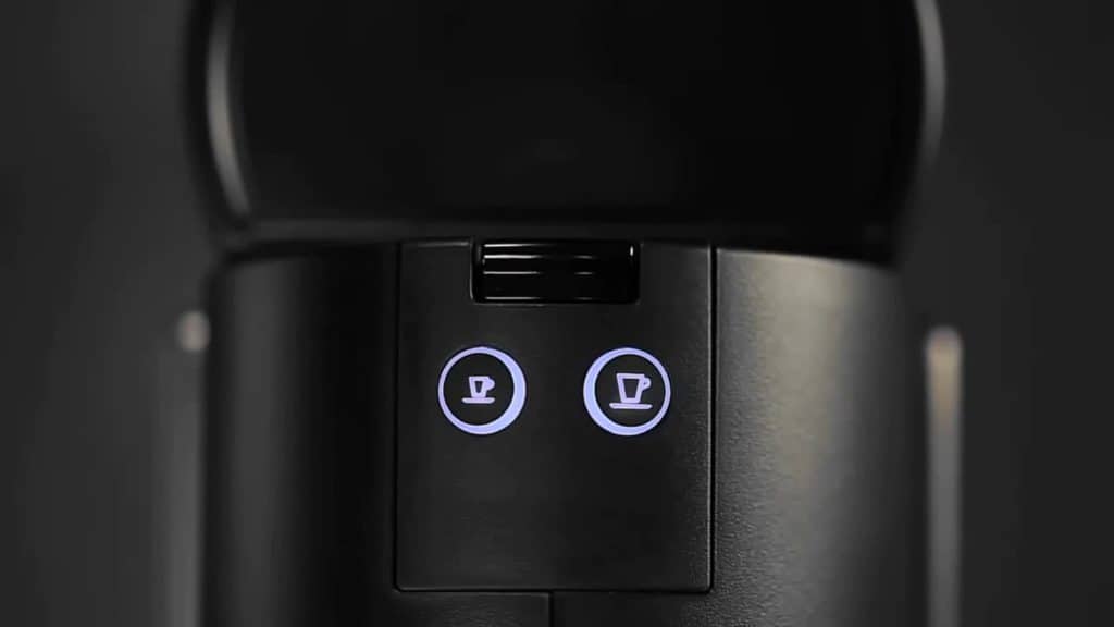Buttons on top of a black Nespresso machine