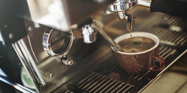 Red eye coffee being brewed on an espresso machine