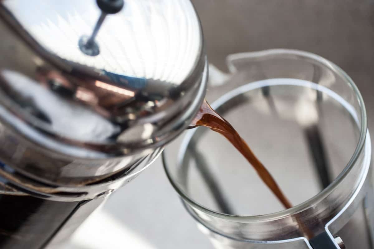 Pouring cold brew from a French press