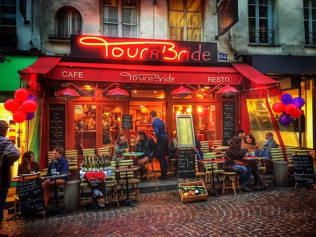 Patrons sit outside the Cafe Tournbride in Paris