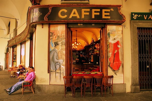 Patrons outside a caffe in Turin, Italy