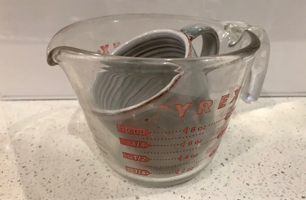 4 ounce coffee cup inside a standard measuring cup