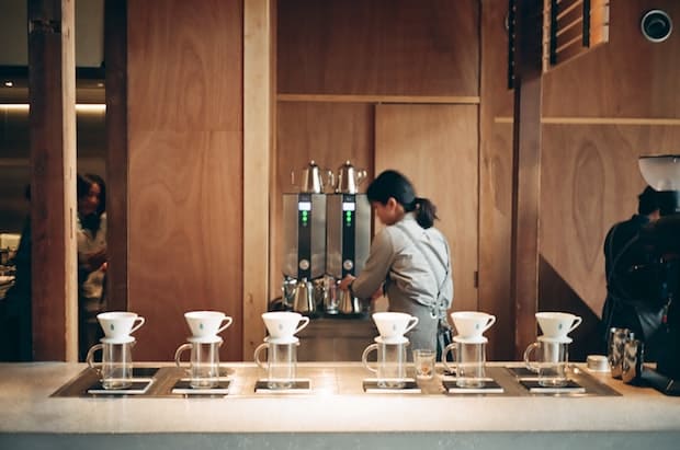 A barista behind the bar at Blue Bottle Coffee in Kyoto, Japan