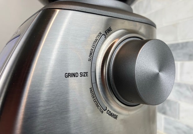Closeup of the grind size knob on the side of a Breville Smart Grinder Pro