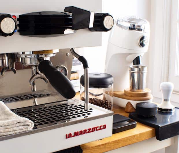 Closeup of a home coffee station featuring a La Marzocco espresso machine