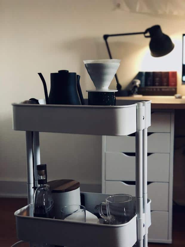 Compact coffee station on a small bar cart