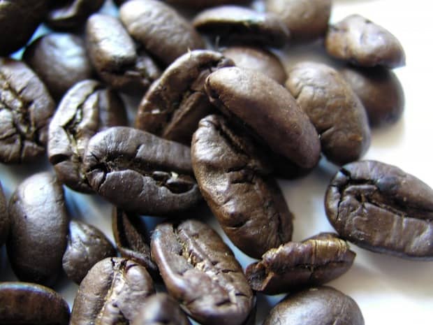 Closeup of kapeng barako coffee beans on a white counter
