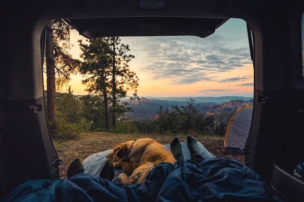 Beautiful sunrise view looking out the back of a camper van