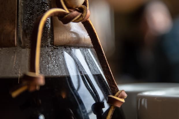 Closeup of hot coffee in a Chemex carafe