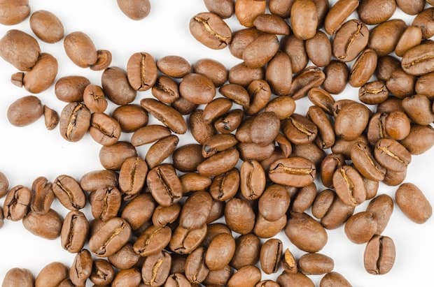 Overhead shot of light-roast coffee beans on a counter