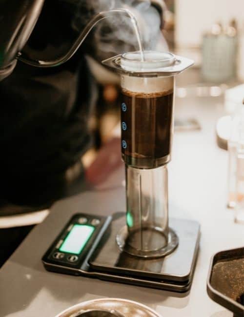 Inverted AeroPress full of coffee on a scale