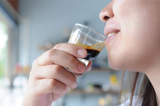 Woman tasting a ristretto shot