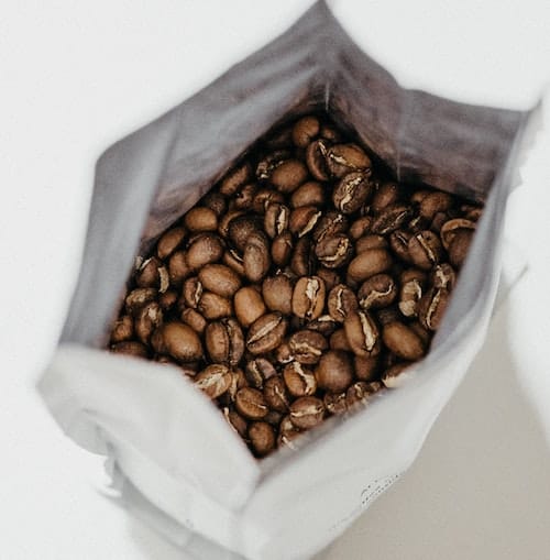 Whole coffee beans inside a bag