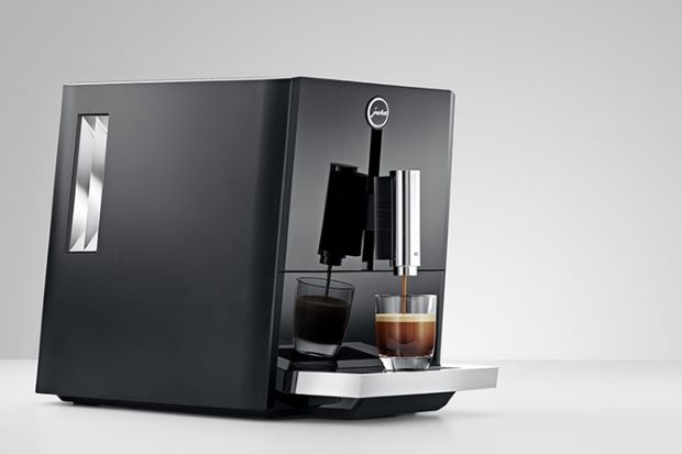 Espresso machine pouring out espresso in a Jura vs. De'Longhi comparison