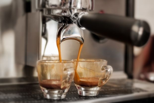 Two shots of espresso being pulled from a heat exchange or dual boiler espresso machine