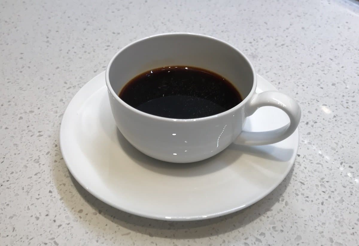 A white cup of Aeropress espresso