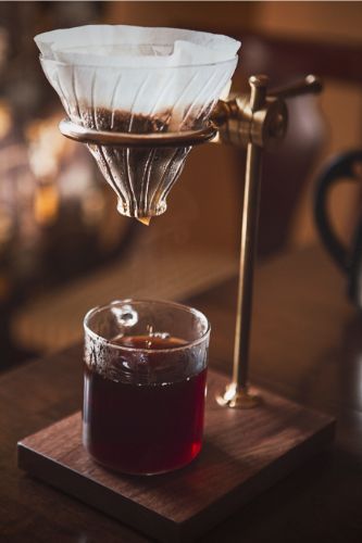 Pour-over coffee stand set up after brewer learned how to aerate coffee