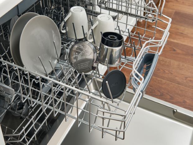 Components of a quiet coffee grinder in the dishwasher