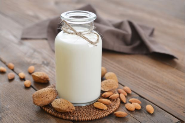 Bottle of almond milk that can be used instead of evaporated milk in coffee