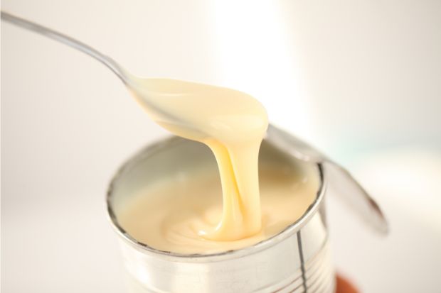Can of condensed milk that can be used instead of evaporated milk in coffee