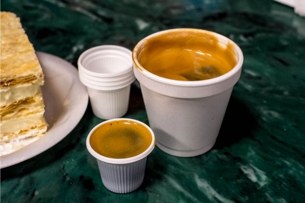 Large cup and espresso cup of colada coffee prepared after brewer learned what is colada coffee