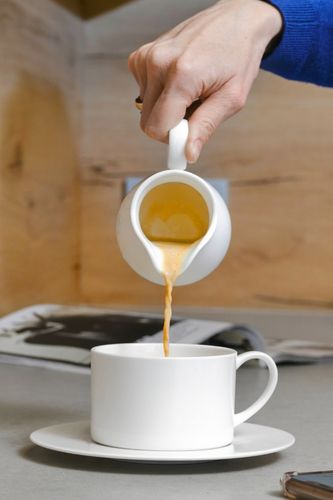 Soy milk being added to coffee as a great coffee creamer substitute