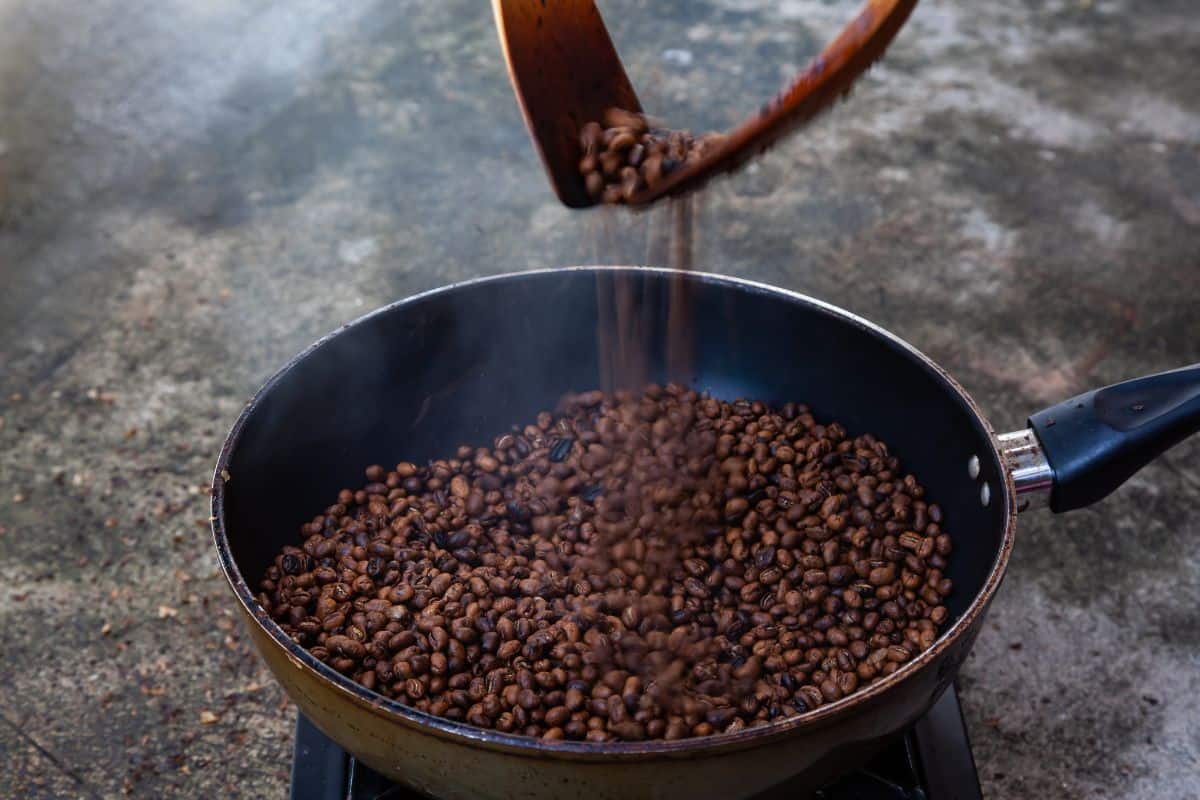 Roasting coffee beans in a pan