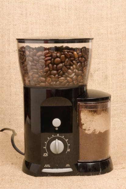 Grinder full of beans for getting the right French press grind size