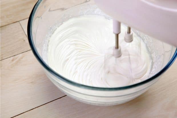 Lightly whipped cream in a glass bowl