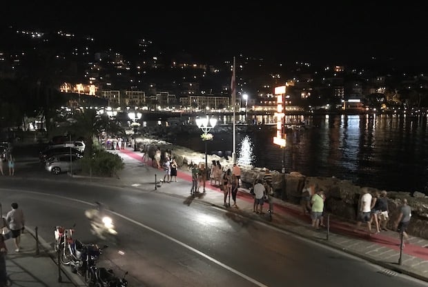 People on the promenade of Santa Margherita Ligure in Italy at night