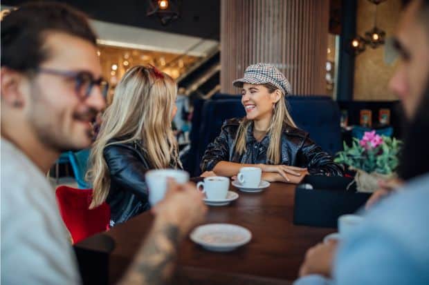 People out for dinner socialize over a cup of coffee